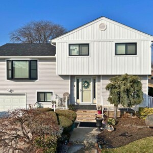 Vinyl Siding in Driftwood color with White Board and Batten