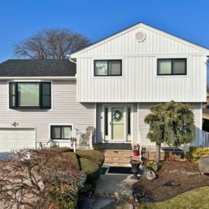 Vinyl Siding in Driftwood color with White Board and Batten
