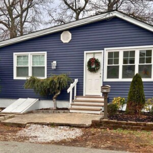 Vinyl Dutchlap Siding in the color Indigo with White trim
