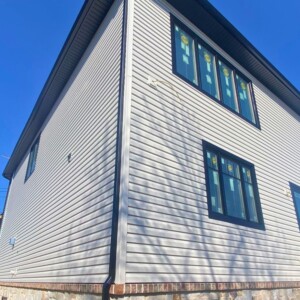 Vinyl Dutchlap Siding in the color Bone with Black Trim