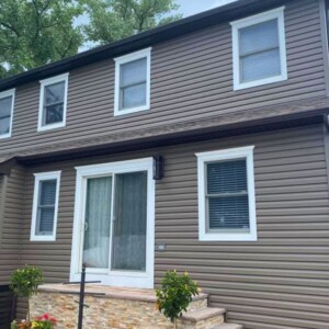 Vinyl Dutchlap Siding in the color Canyon with White trim