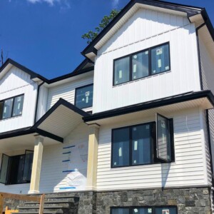 Vinyl Clapboard Siding with Board and Batten in the color White with Black Trim