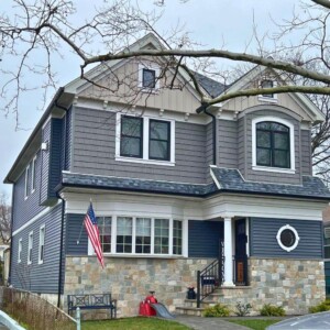 Vinyl Siding in Color Slate, Shake in color Metropolitan Gray, Board & Batten in Color Mocha with White Trim