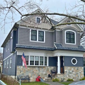 Vinyl Siding in Color Slate, Shake in color Metropolitan Gray, Board & Batten in Color Mocha with White Trim