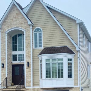 Vinyl Shake and Vinyl Clapboard Siding in the color Country Beige with Azek Trim
