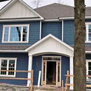 Vinyl Dutchlap Siding with Vinyl Shake in the color Bayou, Azek in the Gable with White trim