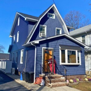 Vinyl Shake and Vinyl Dutchlap Siding in the color Indigo with White trim