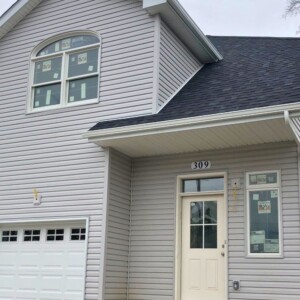 Vinyl Siding in the color Driftwood with white trim