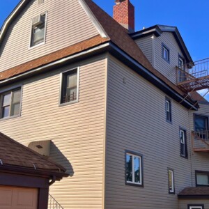 Vinyl Dutchlap siding in Clay color with Musket Brown trim