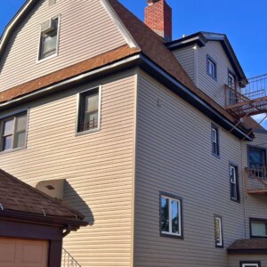 Vinyl Dutchlap siding in Clay color with Musket Brown trim