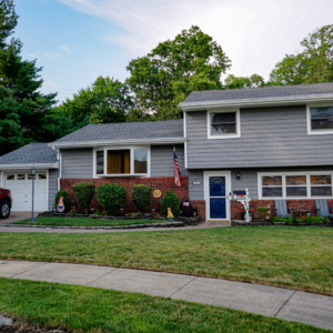 Vinyl Shake and Siding in the Color Gray with White Window and Door Trim