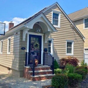 Vinyl Clapboard Siding in the color Clay with White trim