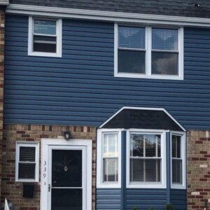 Vinyl Dutchlap Siding in color Regatta Blue with white trim