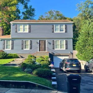 Vinyl Clapboard Siding in the color Slate with White trim