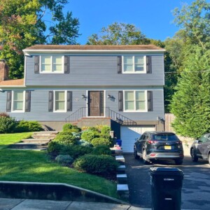 Vinyl Clapboard Siding in the color Slate with White trim