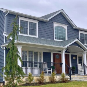 Vinyl Dutchlap Siding with Vinyl shake in the color Slate with White trim
