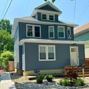 Vinyl Cedar Board Fully Insulated 7" Clapboard Siding in the color Flagstone with White trim