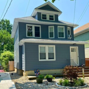 Vinyl Cedar Board Fully Insulated 7" Clapboard Siding in the color Flagstone with White trim