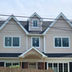 Vinyl Shake and Dutchlap Siding in the Color Country Beige with White trim