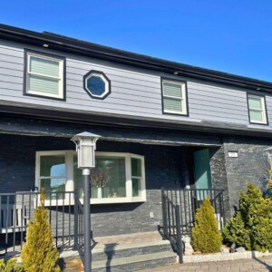 Vinyl 7" Fully Insulated Siding in the color Nantucket with Black trim