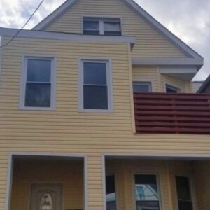 Vinyl Dutchlap Siding in the color Wheat with White trim