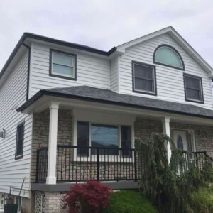 Vinyl Clapboard Siding in the Color White with Black Trim