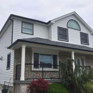 Vinyl Clapboard Siding in the Color White with Black Trim