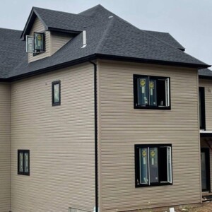 Vinyl Dutchlap Siding in the color Natural Clay with Black Trim